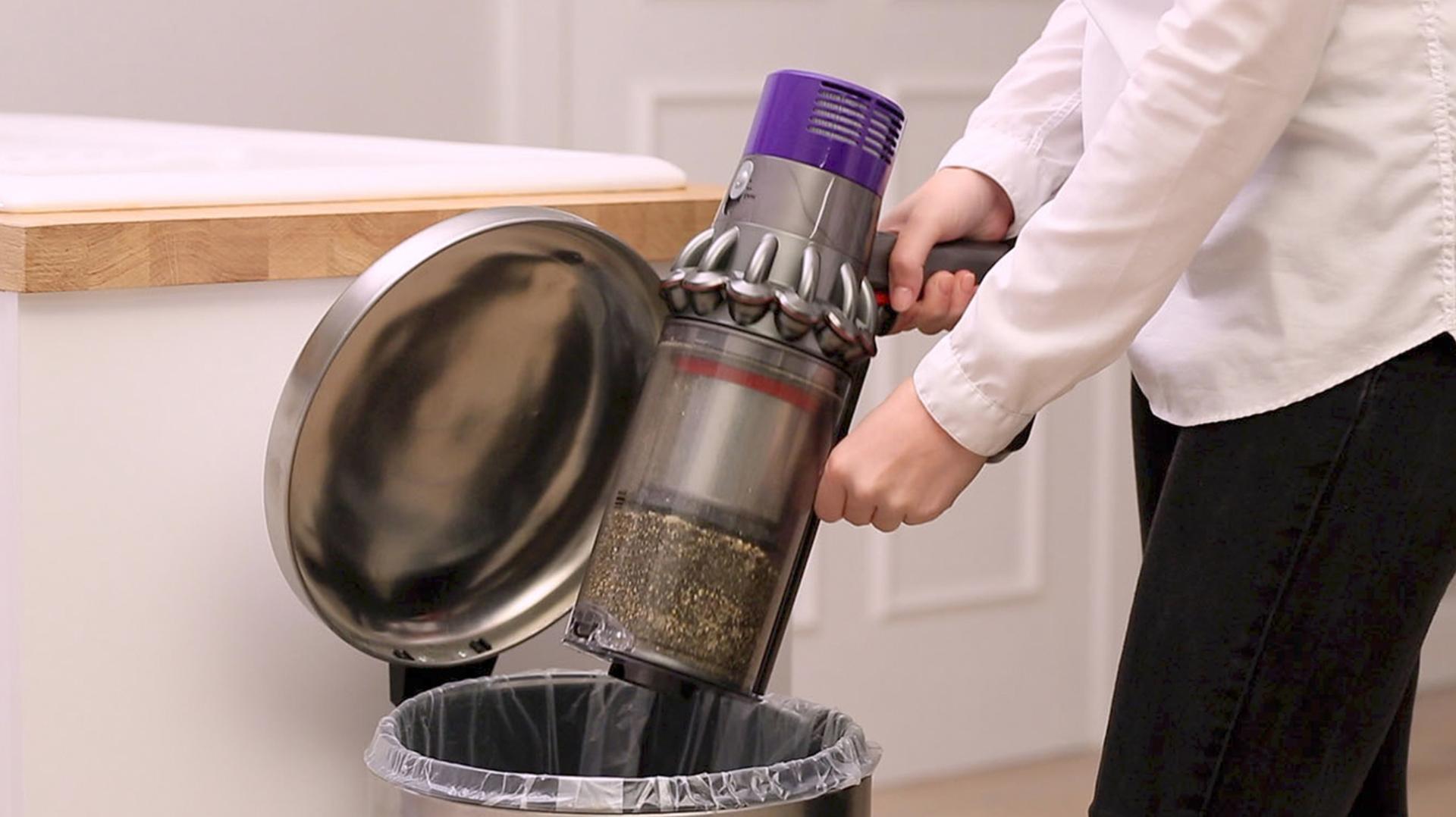 Play the video. How to empty the clear bin.