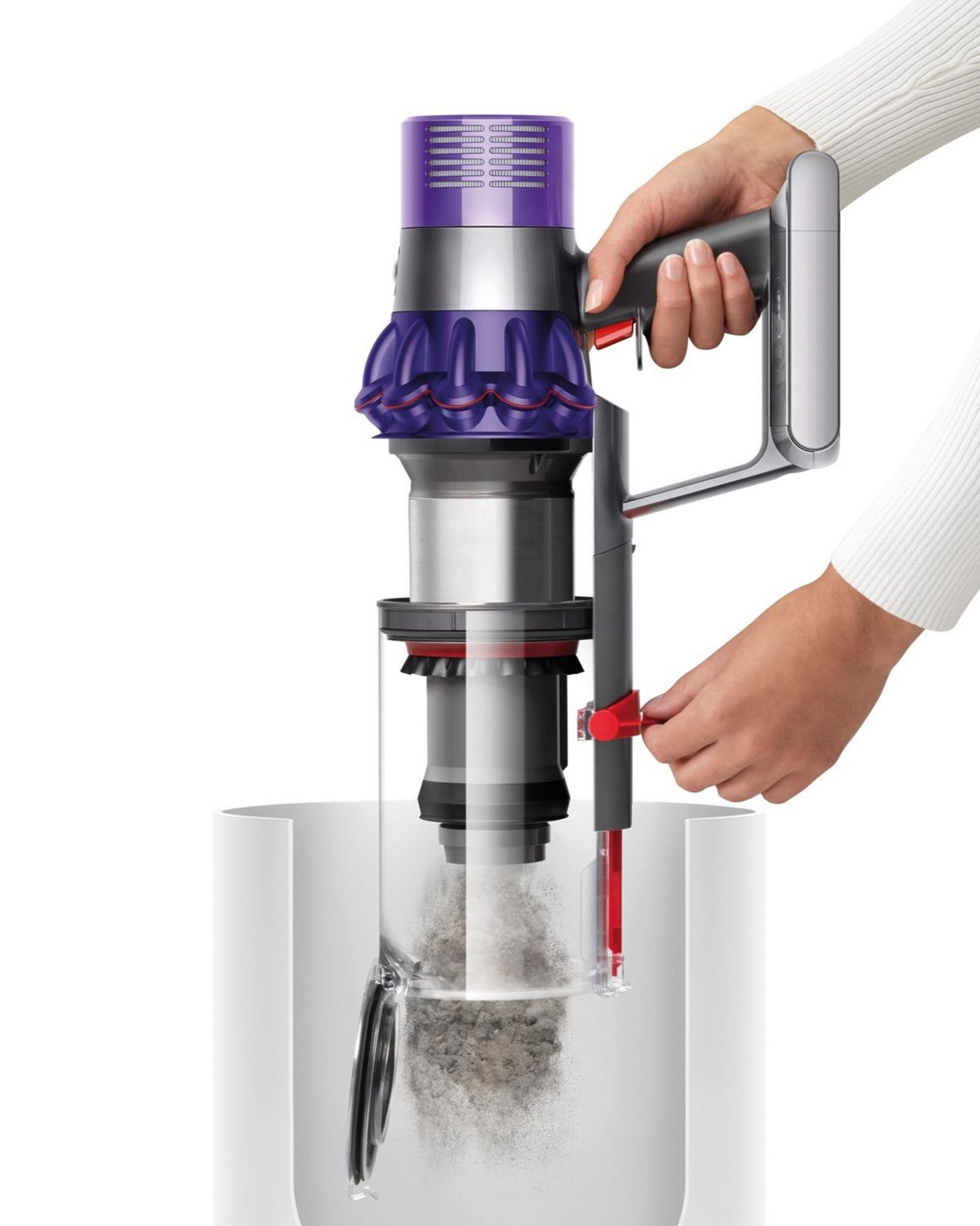 Dyson V10 Animal cordless vacuum cleaner being emptied into bin using the hygienic point and shoot system.