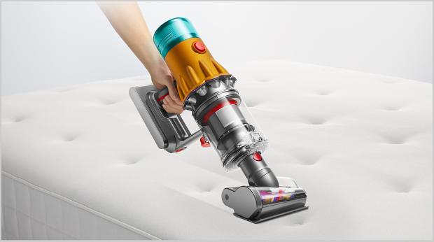 Hair screw tool cleaning a mattress