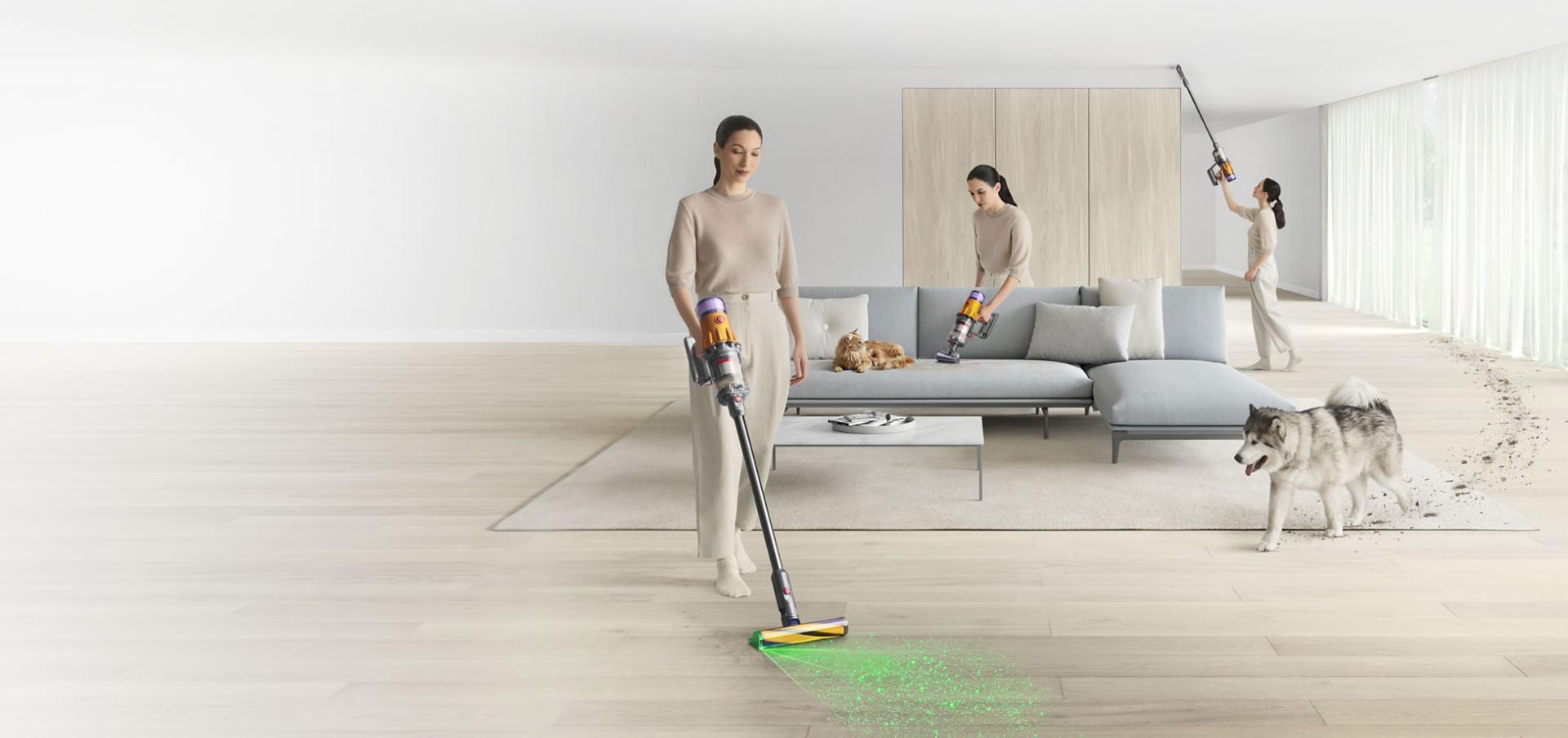 A woman vacuuming a large room using the Dyson V12 detect vacuum in cordless and handheld modes.