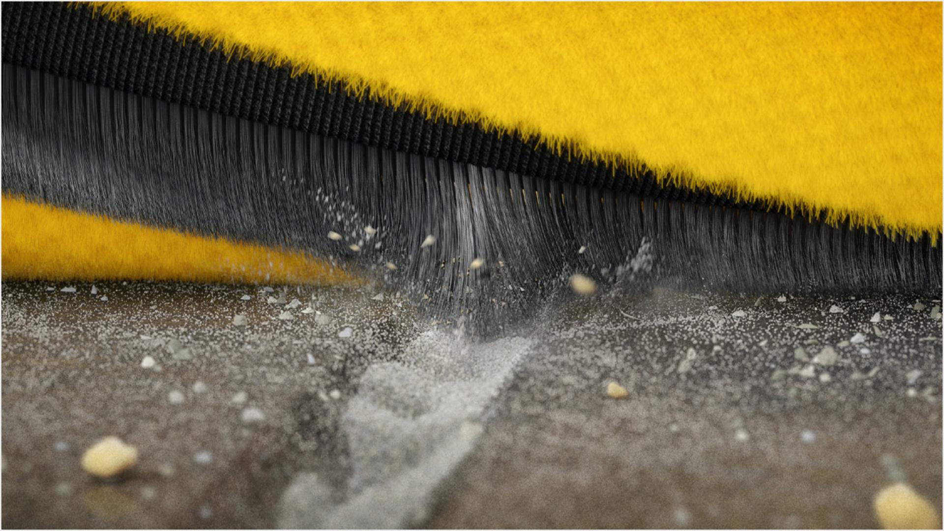 Carbon fibre filaments extracting particles from a floor crevice.