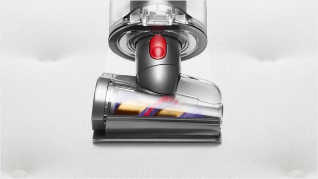 Hair screw tool cleaning a mattress.