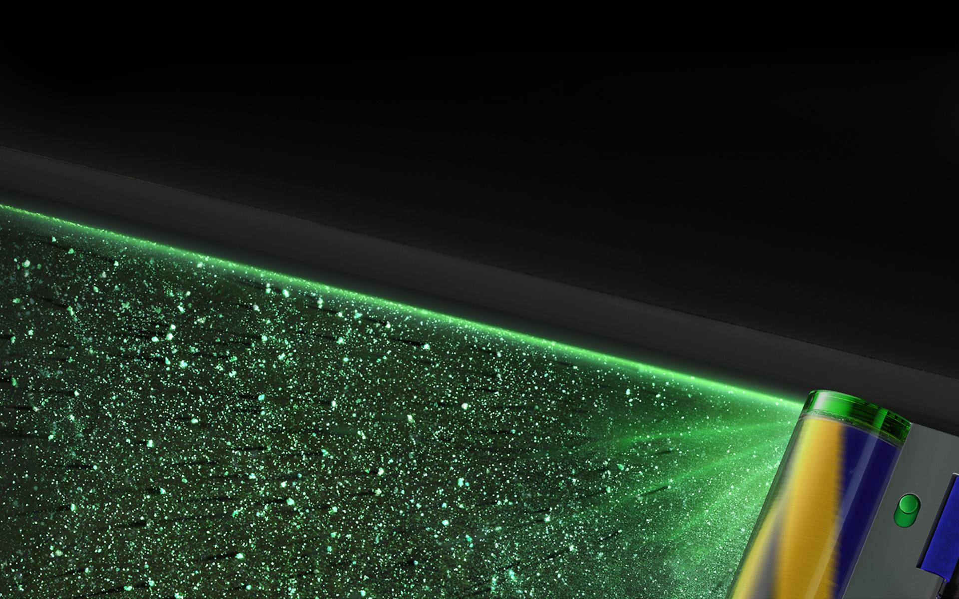Detail zeleného laseru zvýrazňující skrytý prach