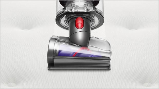 Hair screw tool cleaning a mattress