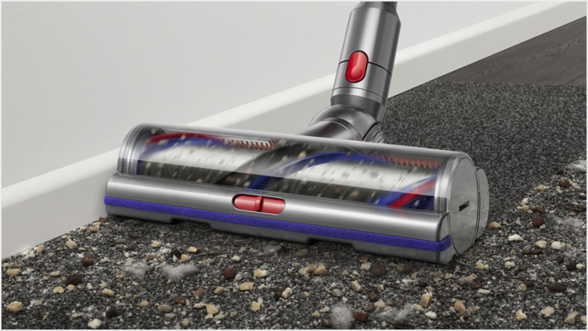 Close-up of Digital Motorbar cleaner head powerfully removing debris from a carpet.