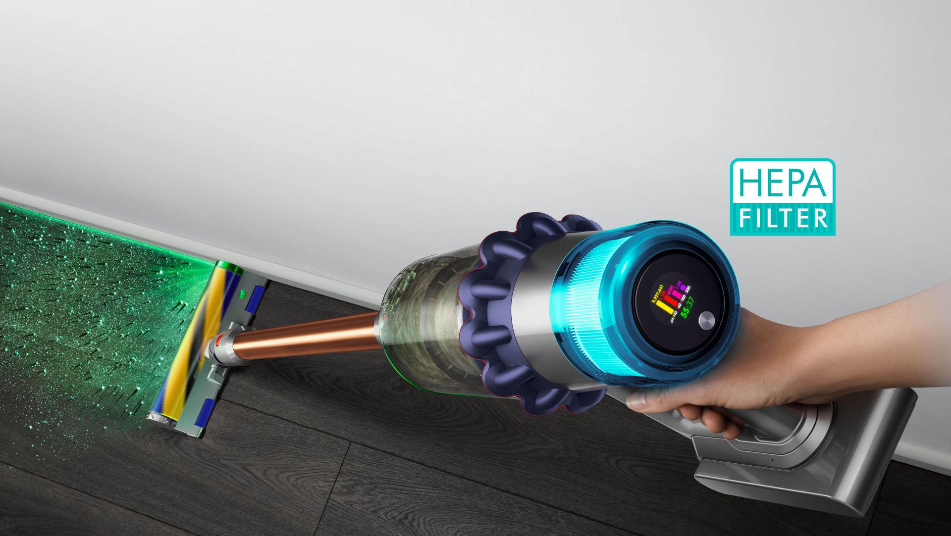 Close-up of hand holding the Dyson V15 Detect vacuum