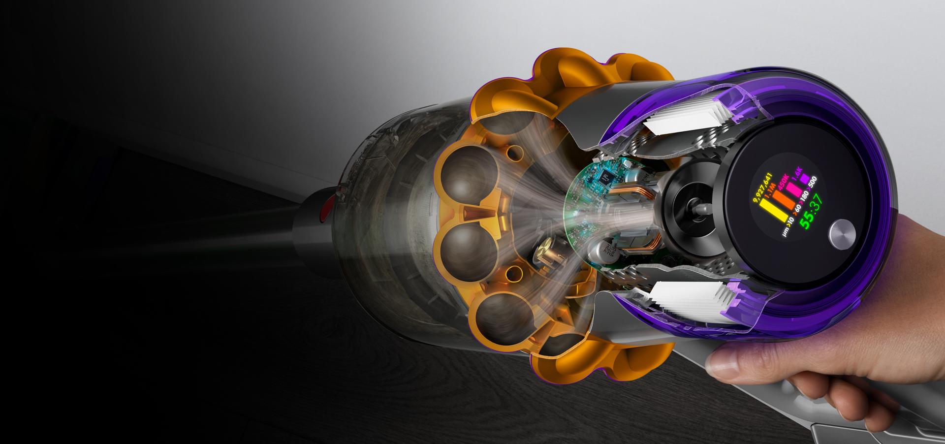 A cutaway of the side of a Dyson V15s showing debris being filtered with the LCD user screen displaying the run time and particle counts.