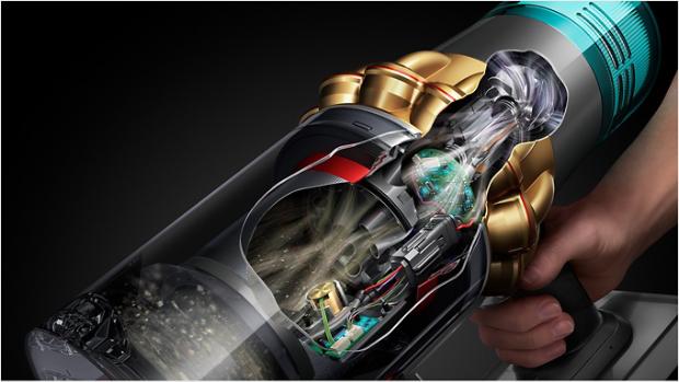 Dyson V15 Detect Submarine sānu šķērsgriezums, kurā redzams, kā caur ierīci tiek filtrēti netīrumi.