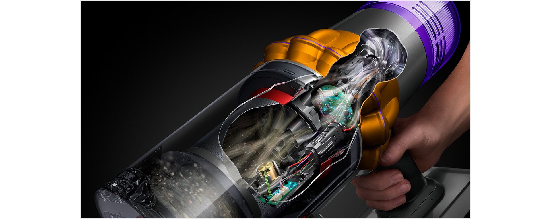 A cutaway of the side of a Dyson V15s showing debris being filtered throughout the machine.
