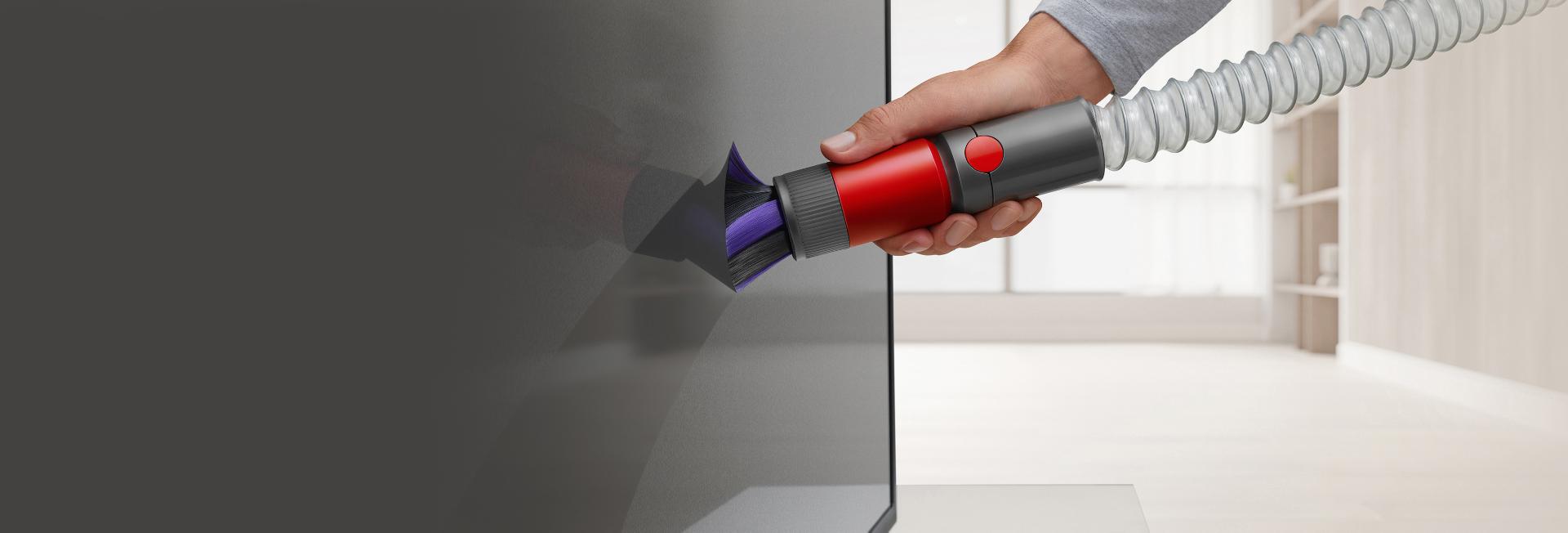 Scratch-free dusting brush cleaning a TV screen