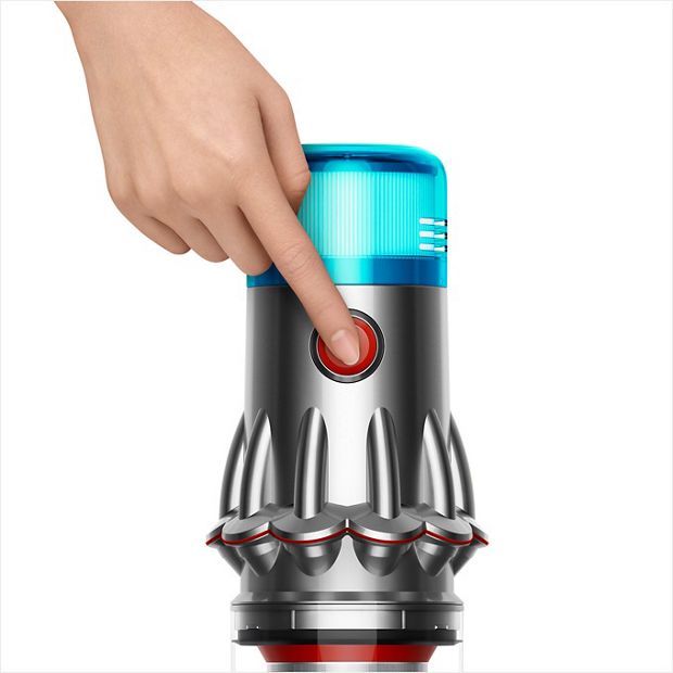 Finger presses power button.