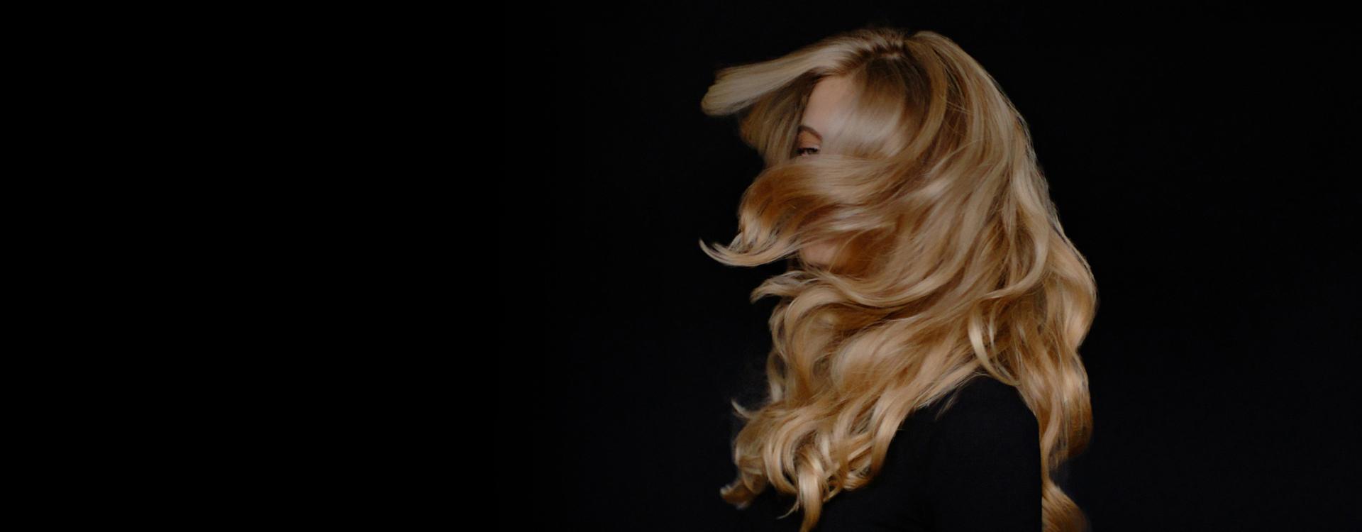 Model swishing her long, styled hair