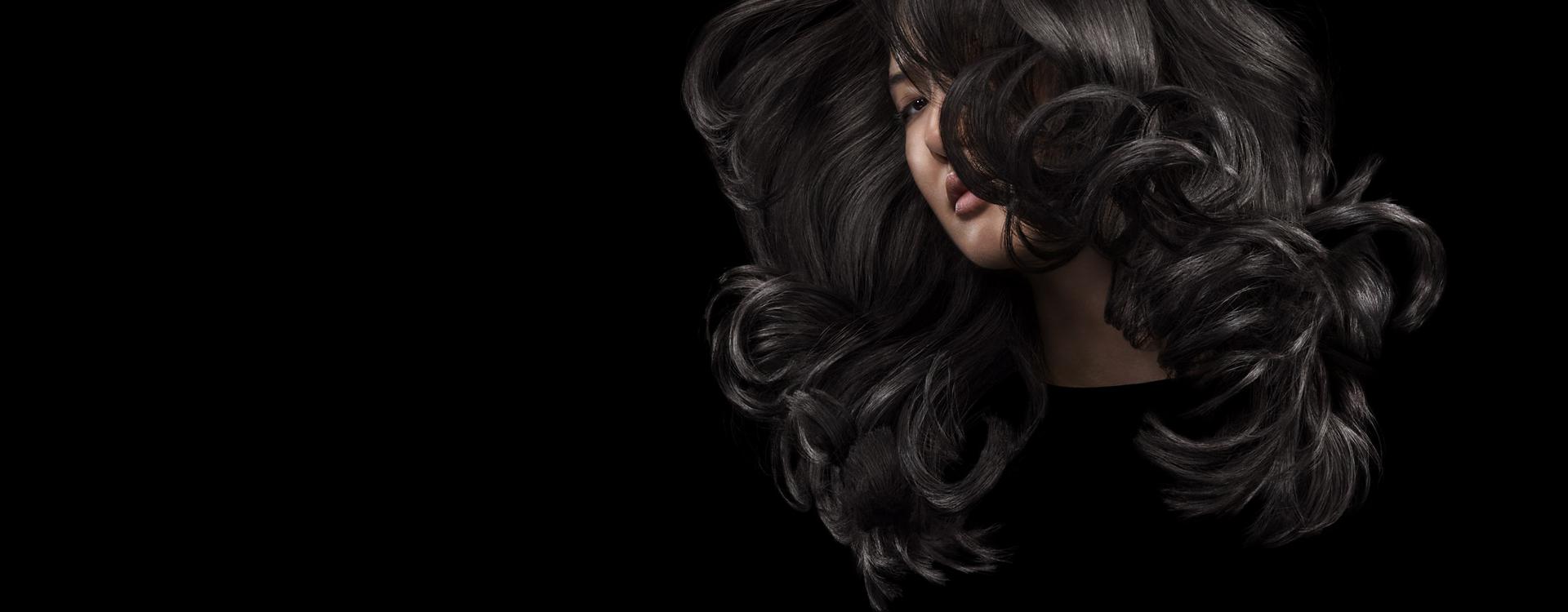 Model swishing her long, styled hair