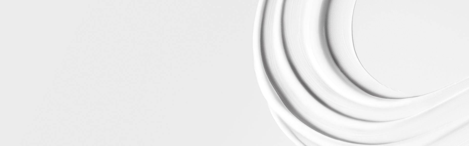 A close-up of the Pre-style cream's smooth texture