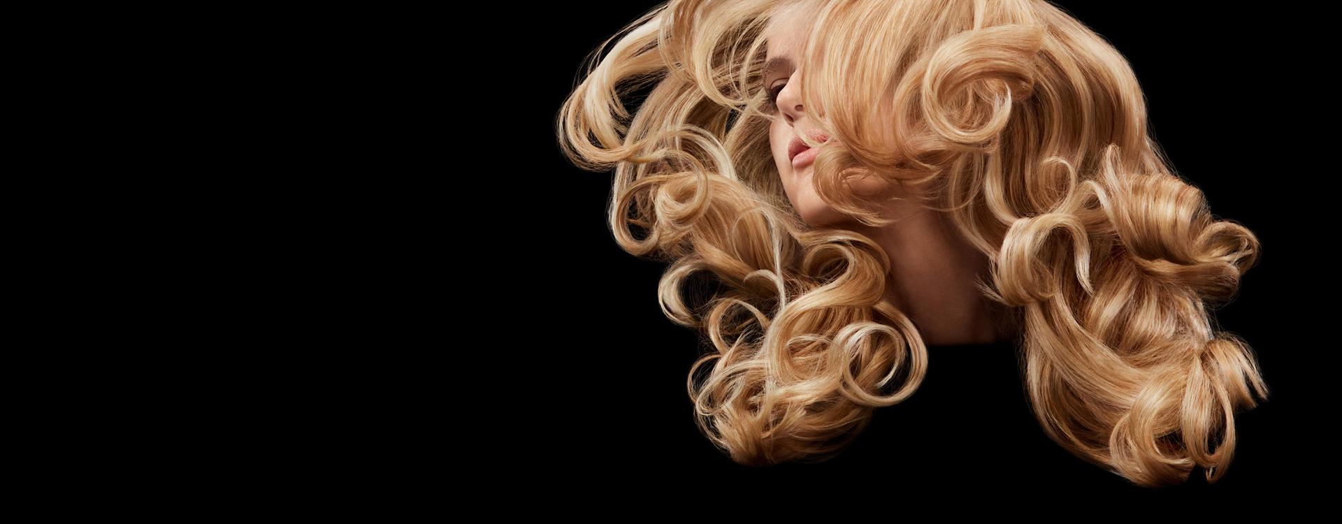 Model swishing her long, styled hair