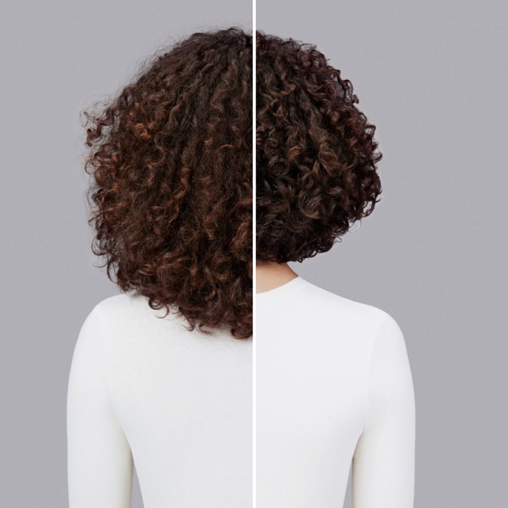 A before and after of a woman with coily hair styled with Dyson Chitosan Pre-style cream.