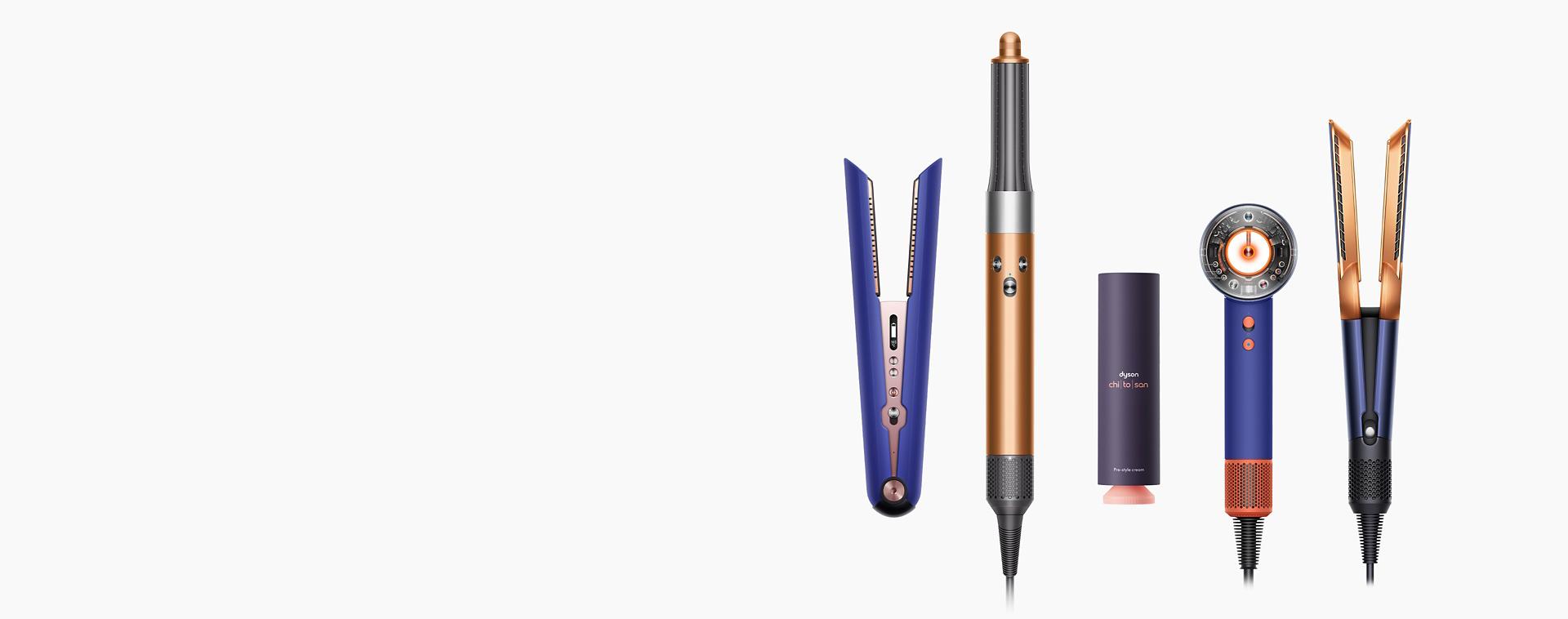 A line-up of Dyson hair care devices on a white background.