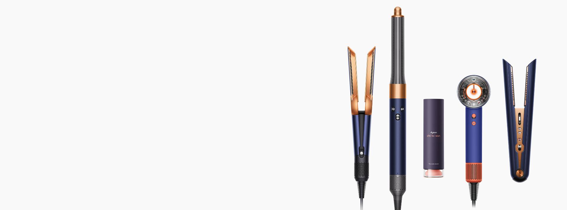 A line-up of Dyson hair care devices on a white background.