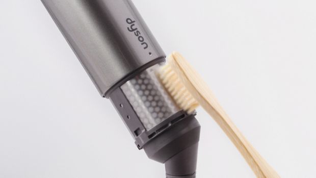 User brushes the filter mesh.