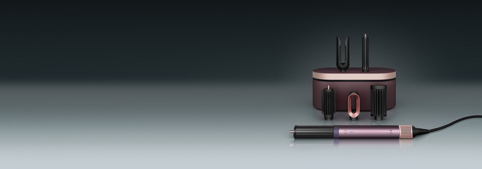 A model diffuses her coily hair using the Dyson Airwrap Co-anda2x multi-styler and dryer.