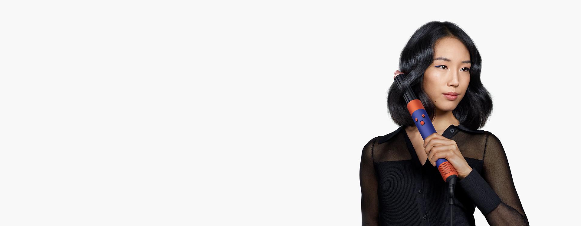 Model using the Airwrap i.d. multi-styler and dryer.