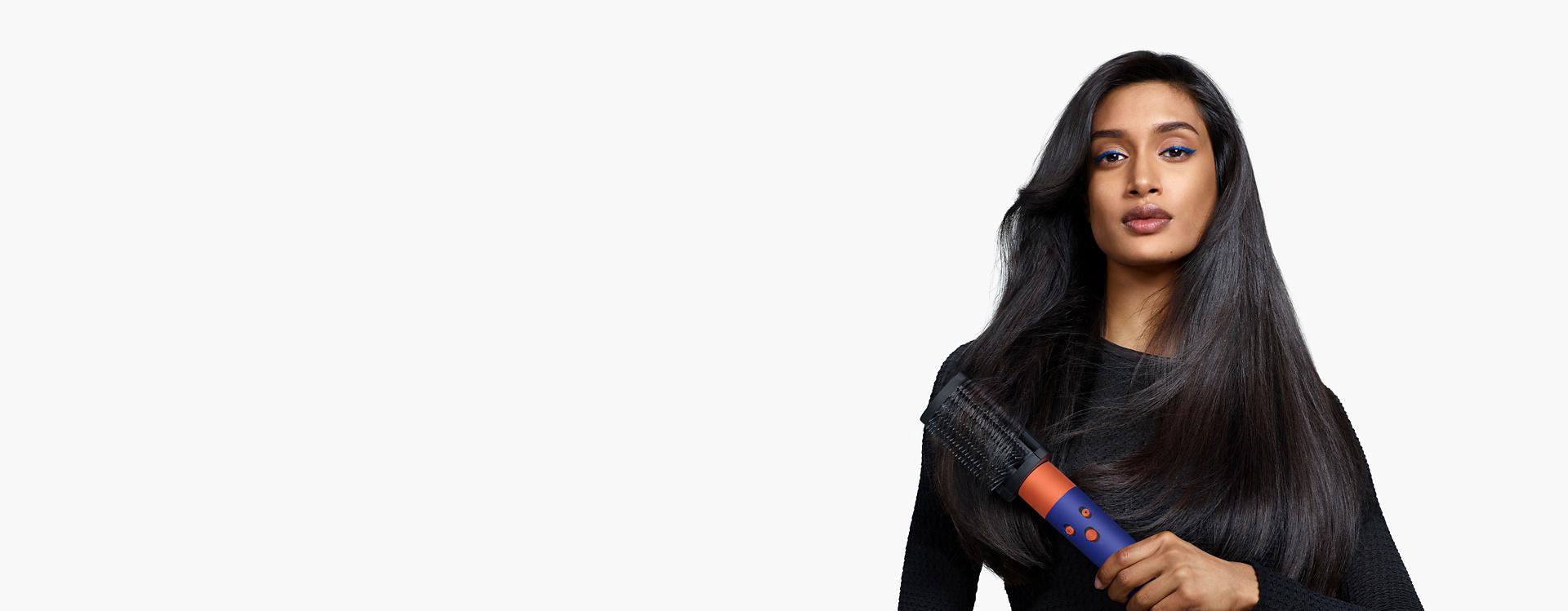 Model using the Airwrap i.d. multi-styler and dryer.