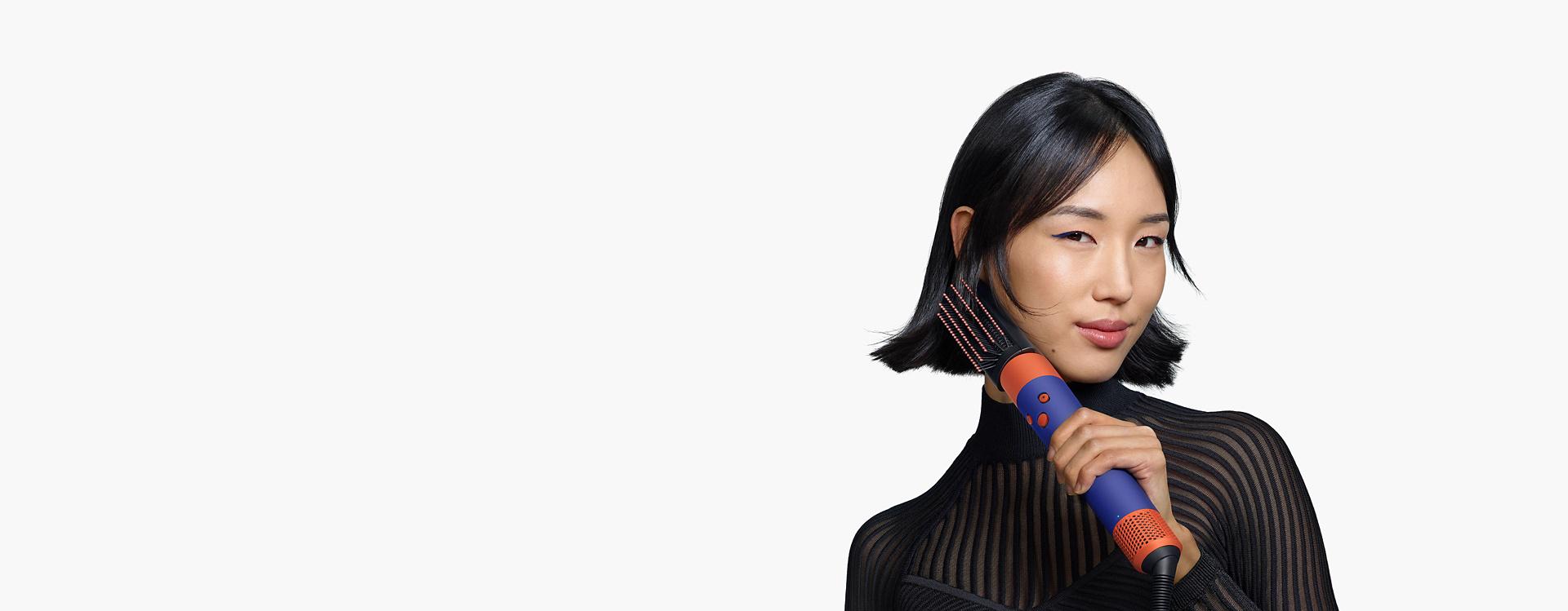 Model using the Airwrap i.d. multi-styler and dryer.