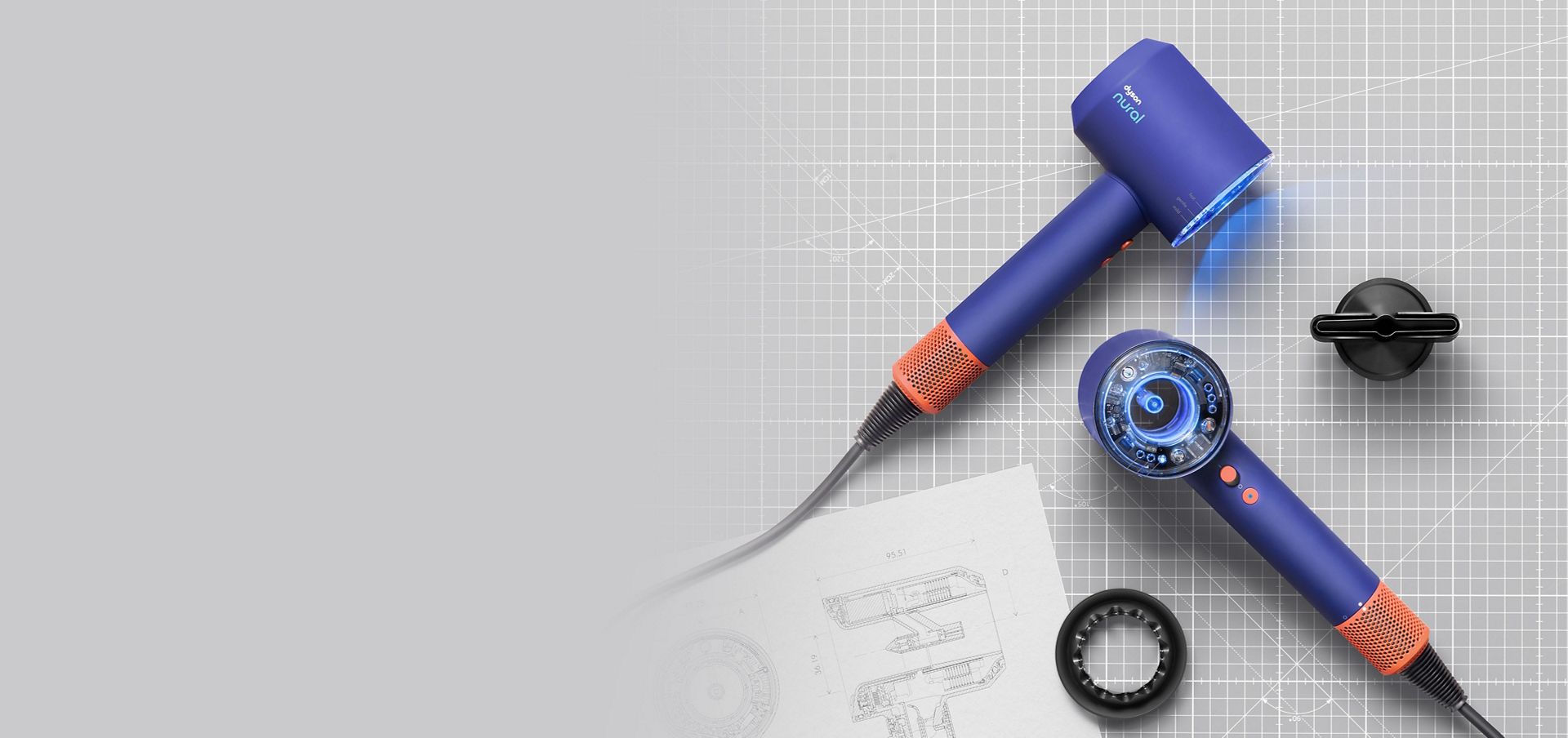 The Dyson Supersonic Nural hair dryer laid on engineering drawings