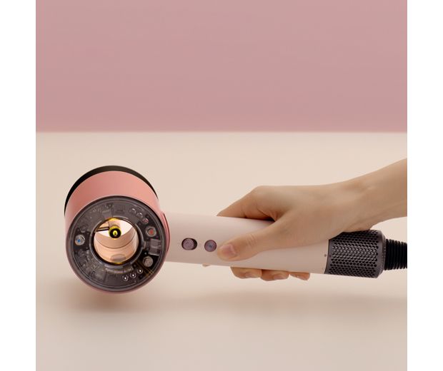 The Dyson Supersonic Nural hair dryer is rested on a table, activating the Pause detect mode.