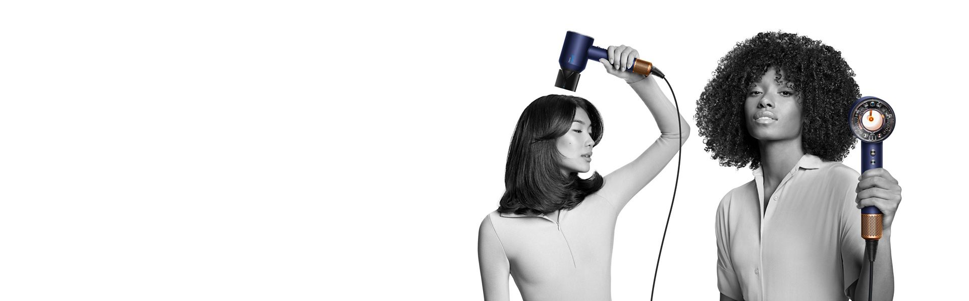 A woman with coily, voluminous hair and a man with short blunt hair.