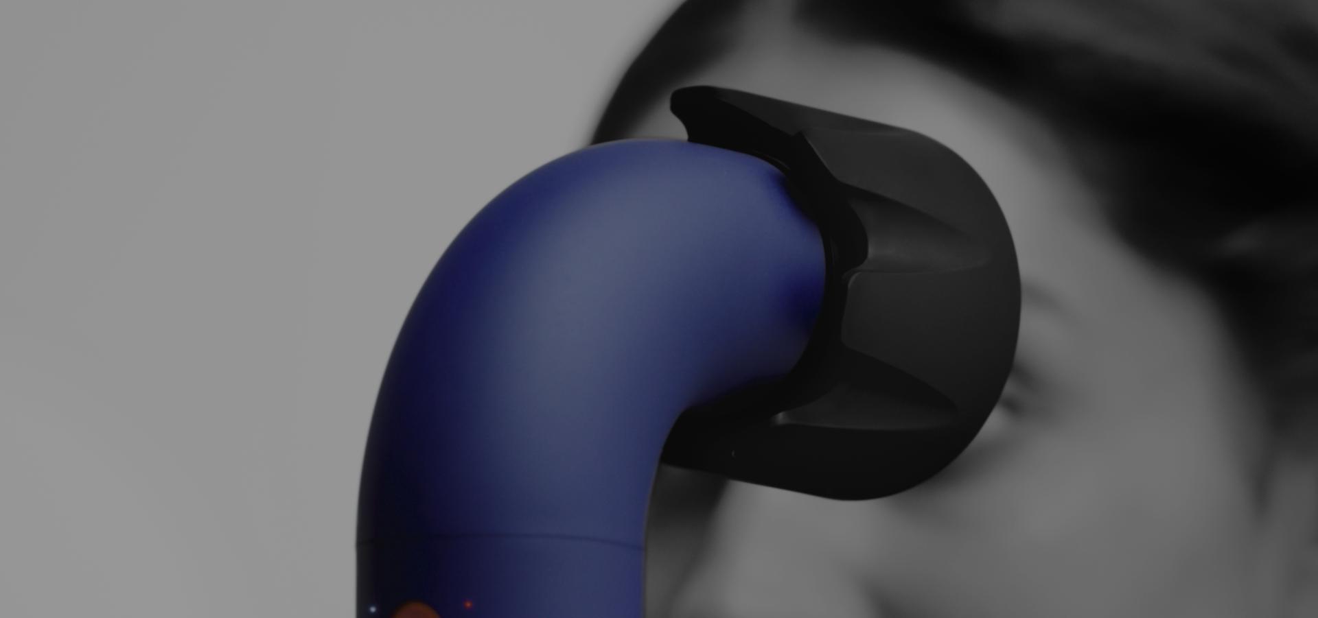 Model using Dyson Supersonic r and powerful air attachment to dry hair.