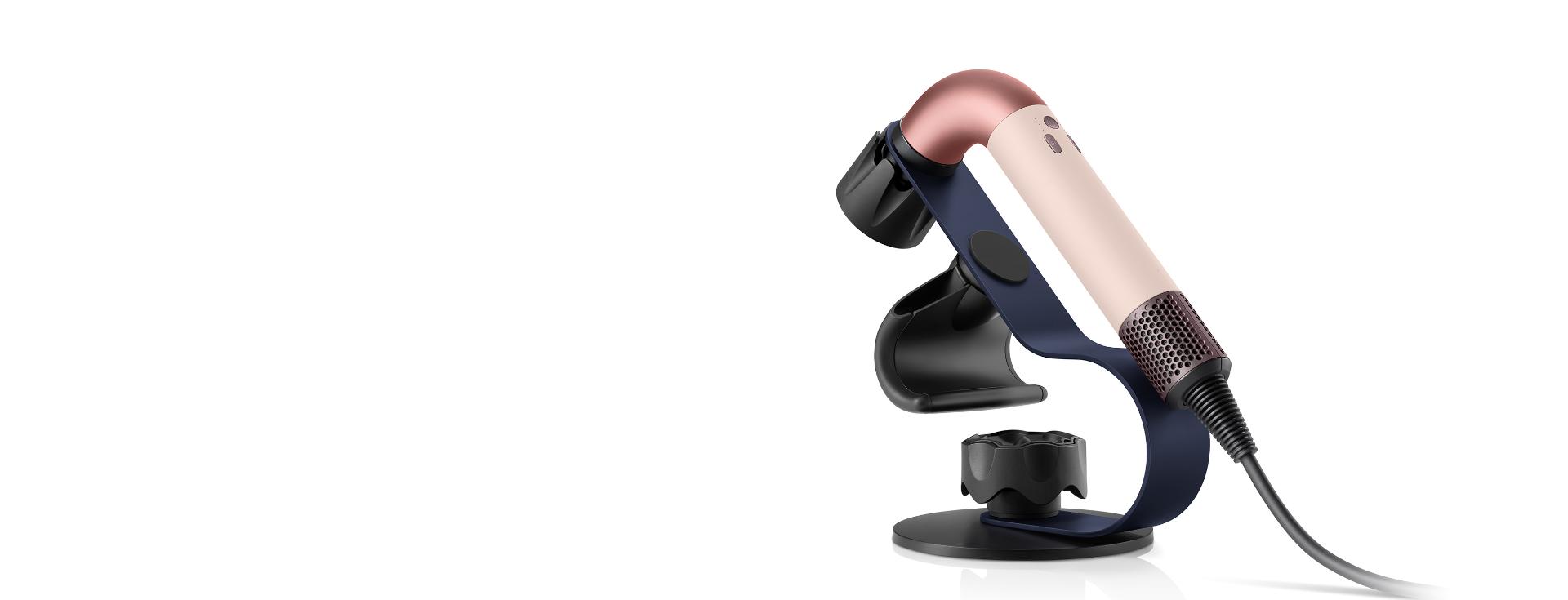 Dyson Supersonic r hair dryer mounted on the Display stand with attachments magnetically attached.