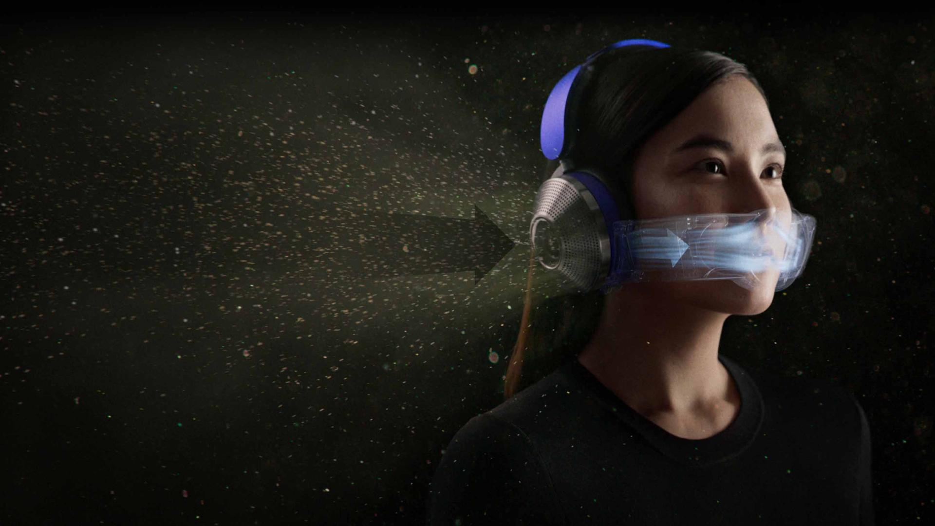 Woman wearing the Dyson Zone headphones with air purification. Arrows show the direction of airflow.