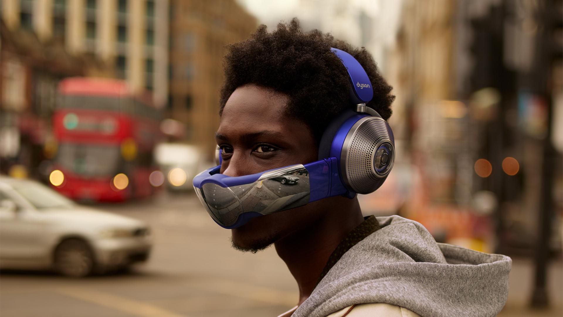 Man wearing Dyson Zone headphones with air purification with visor attached.
