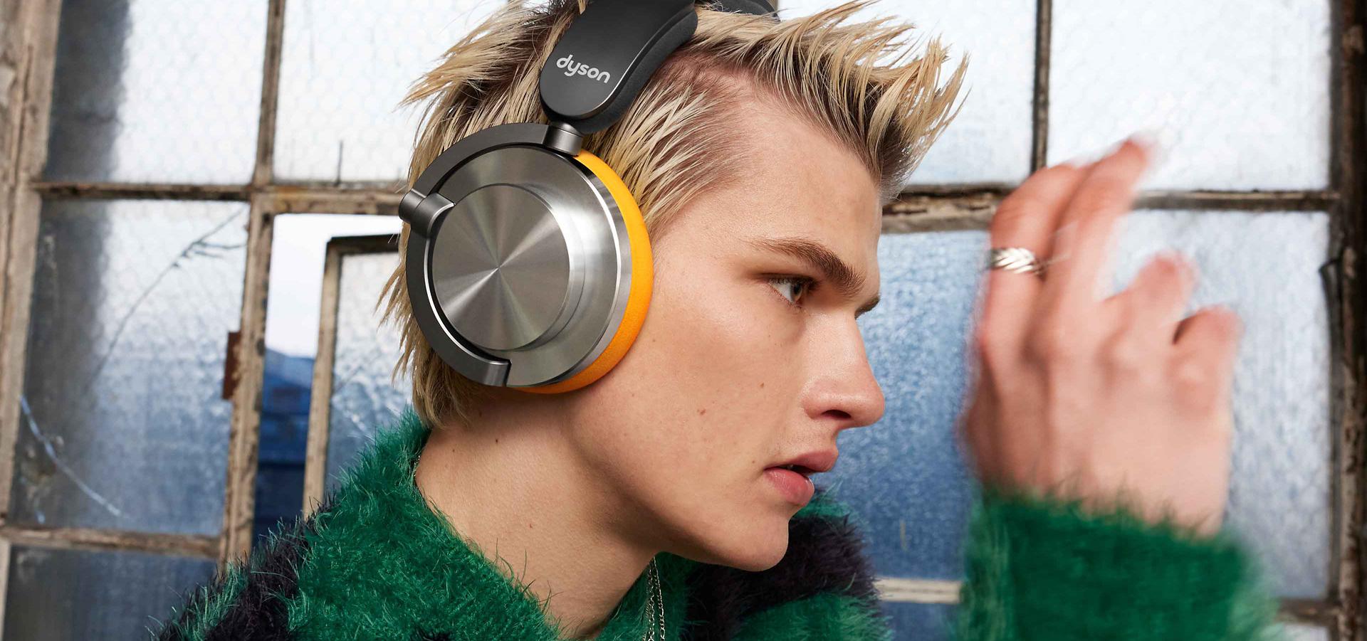 A model wearing Dyson OnTrac headphones.