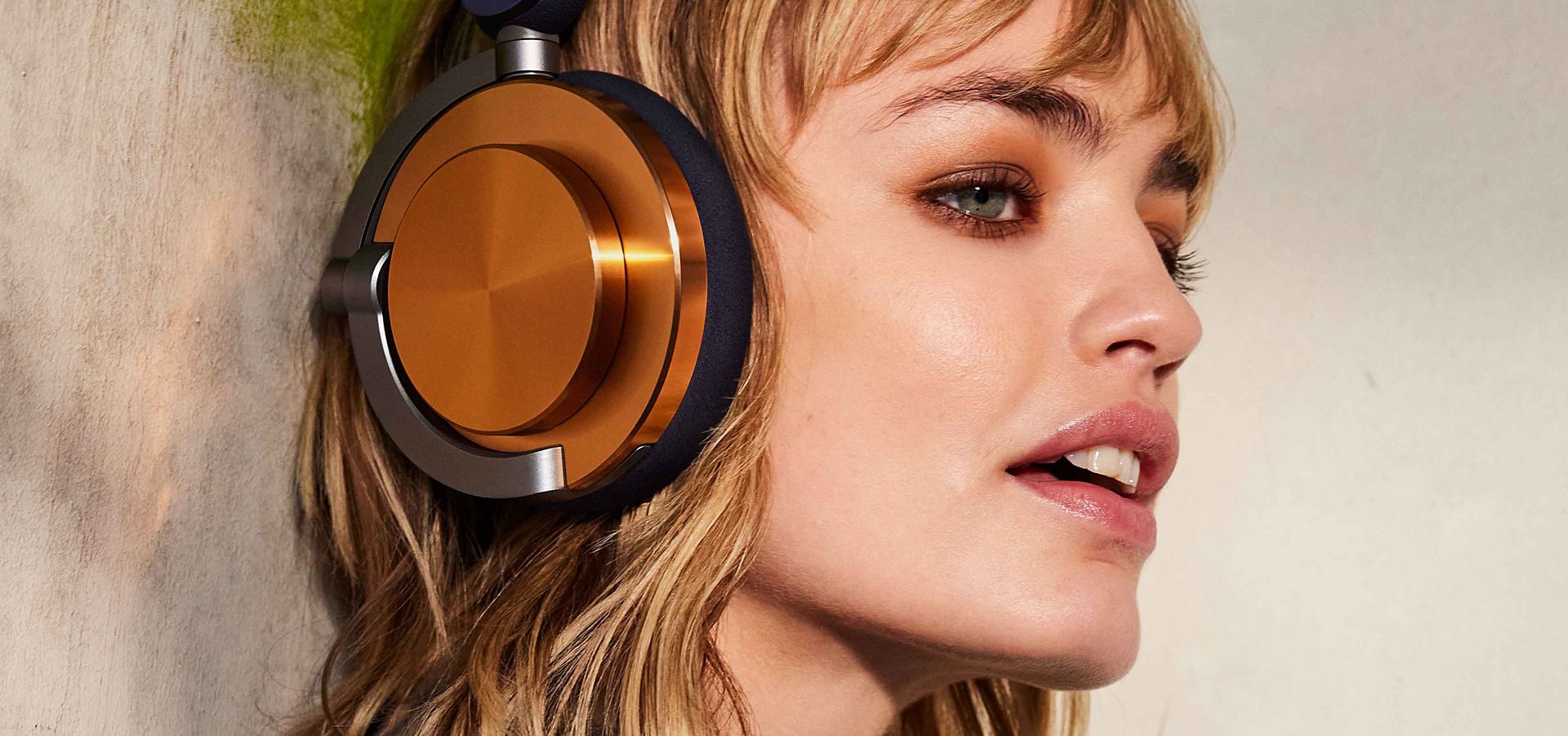 A model wearing the Dyson OnTrac headphones.