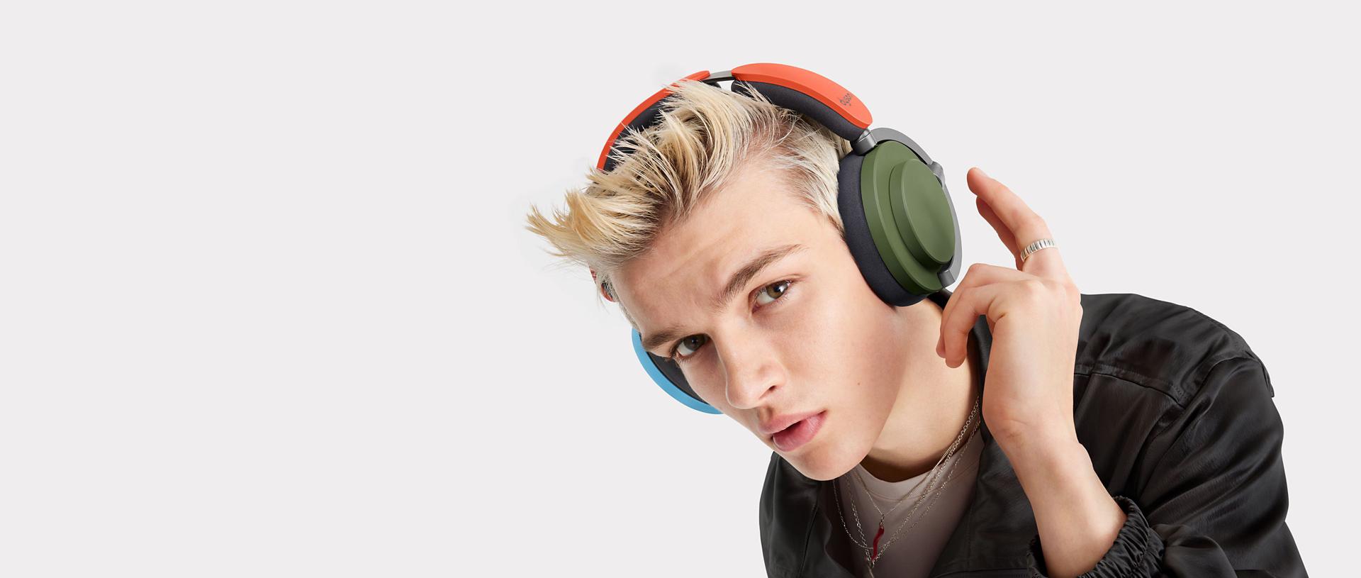 Model wearing Dyson OnTrac headphones.