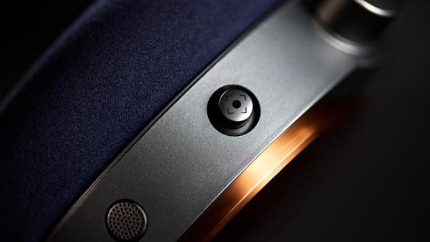 Close-up shot of the intuitive joystick on the Dyson OnTrac headphones.