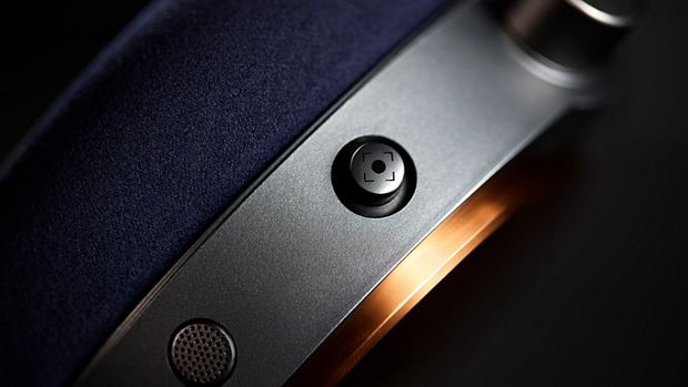 Close-up shot of the intuitive joystick on the Dyson OnTrac headphones.