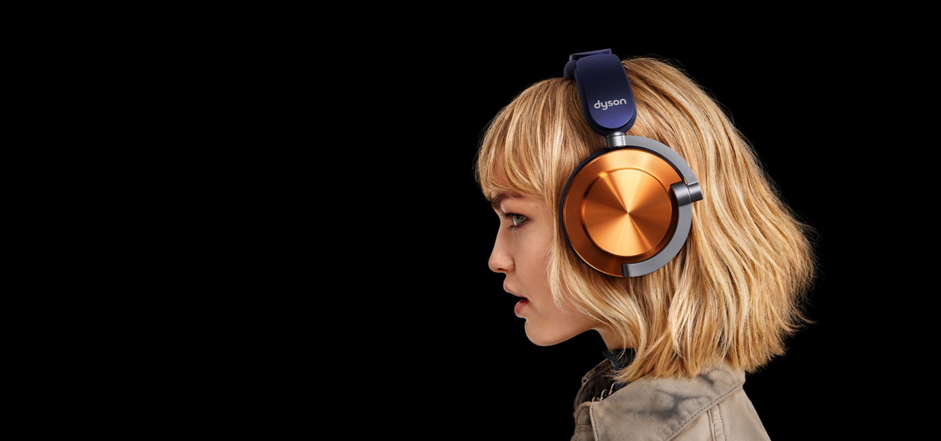 A model wearing Dyson OnTrac headphones.