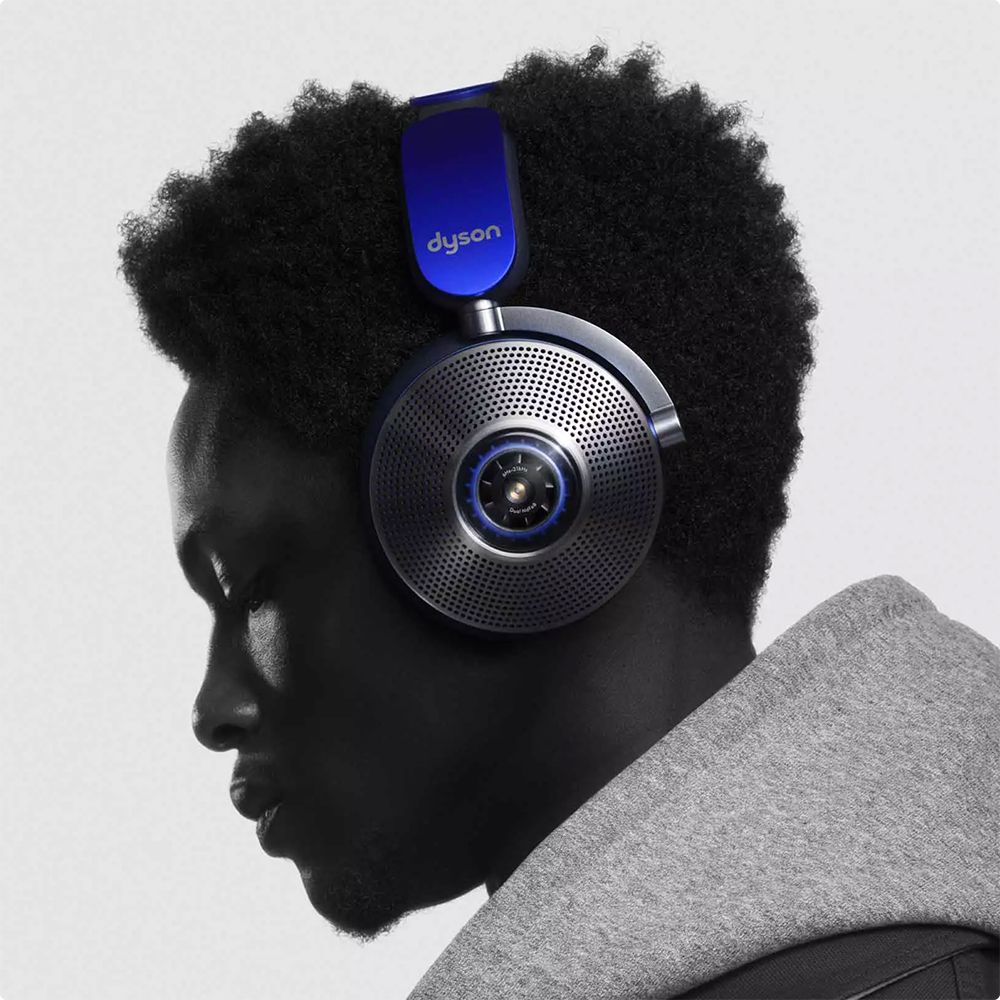 Side view of a male model wearing the Dyson Zone noise-cancelling headphones.