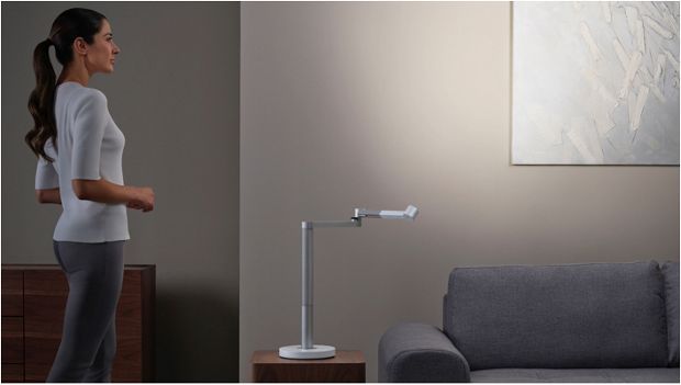 Woman working under the Dyson Lightcycle Morph light in Feature position