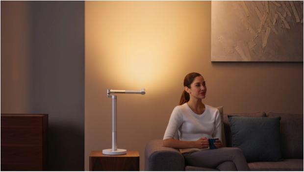 Woman working under the Dyson Lightcycle Morph light in Indirect position