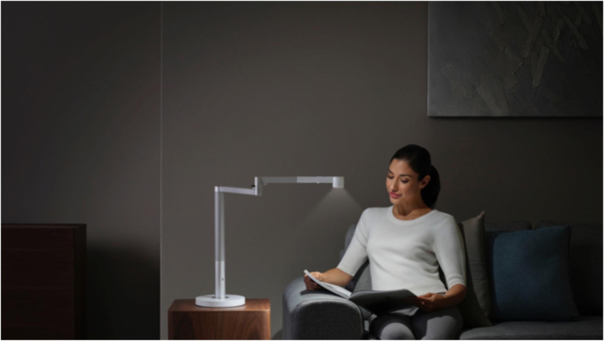 Woman working under the Dyson Lightcycle Morph light in Task position