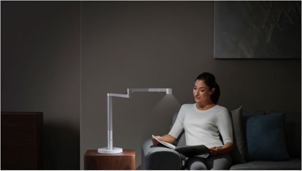 Woman working under the Dyson Lightcycle Morph light in Task position