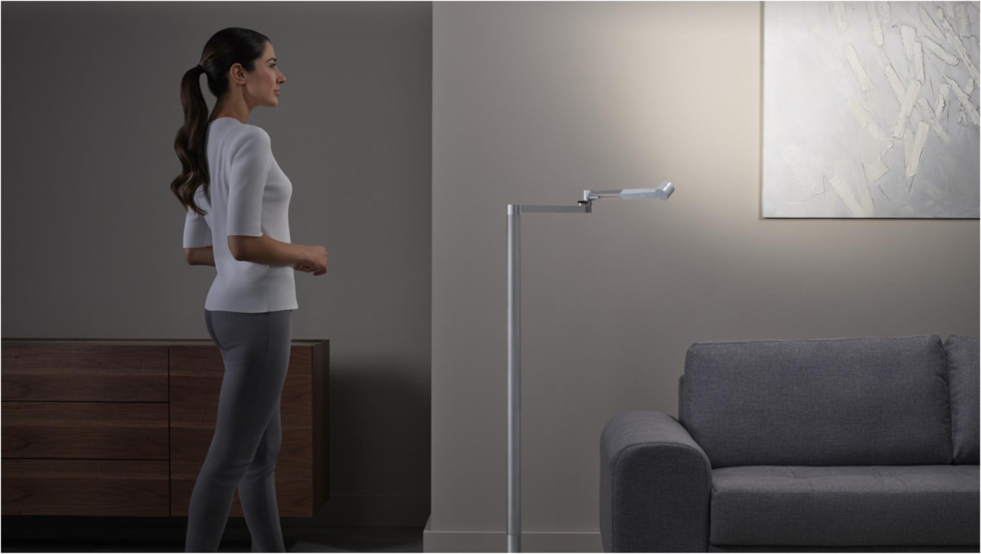 Woman working under the Dyson Lightcycle Morph light in Feature position