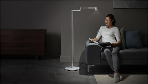 Woman working under the Dyson Lightcycle Morph light in Task position