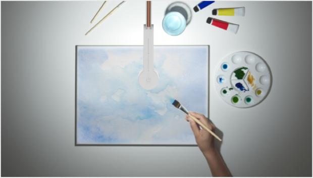 Someone painting under the Dyson Lightcycle task light