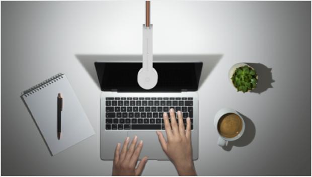 Someone studying under the Dyson Lightcycle task light