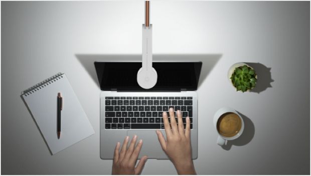 Someone studying under the Dyson Lightcycle task light